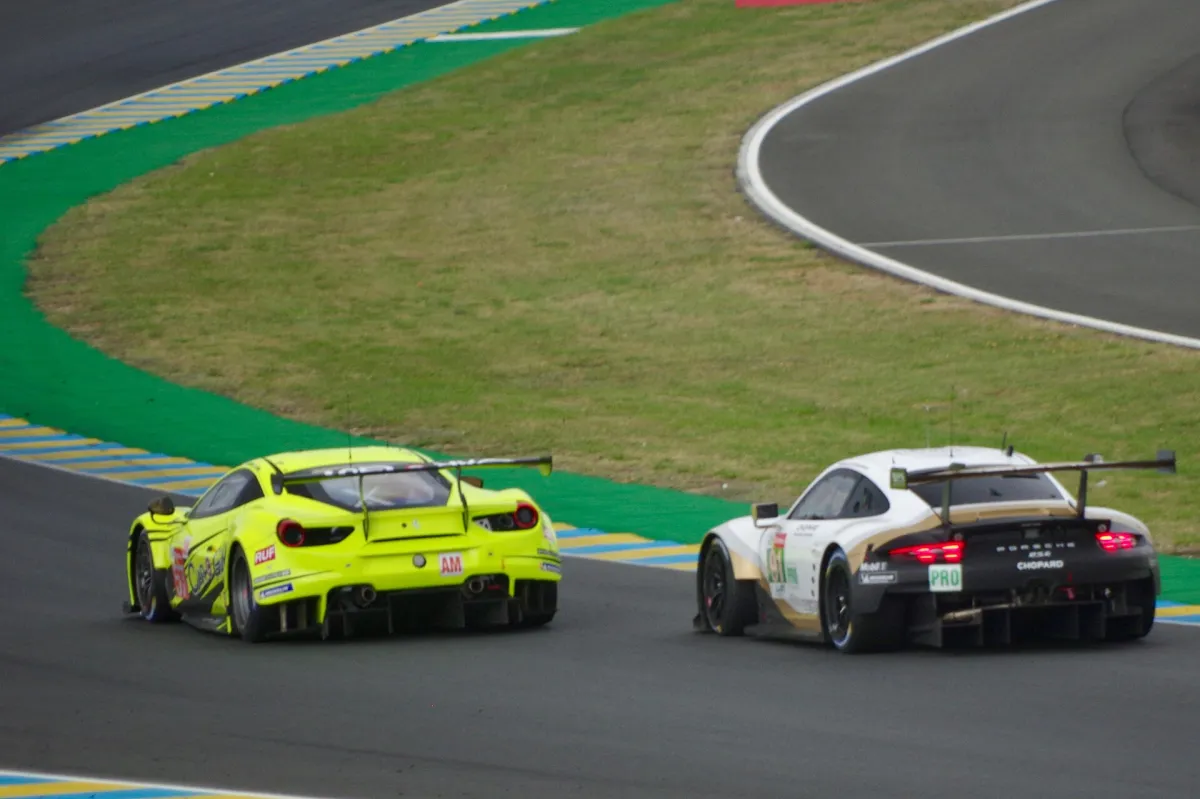 Ferrari and Porsche battling at Le Mans